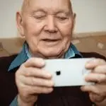 User research with a senior using an iPhone